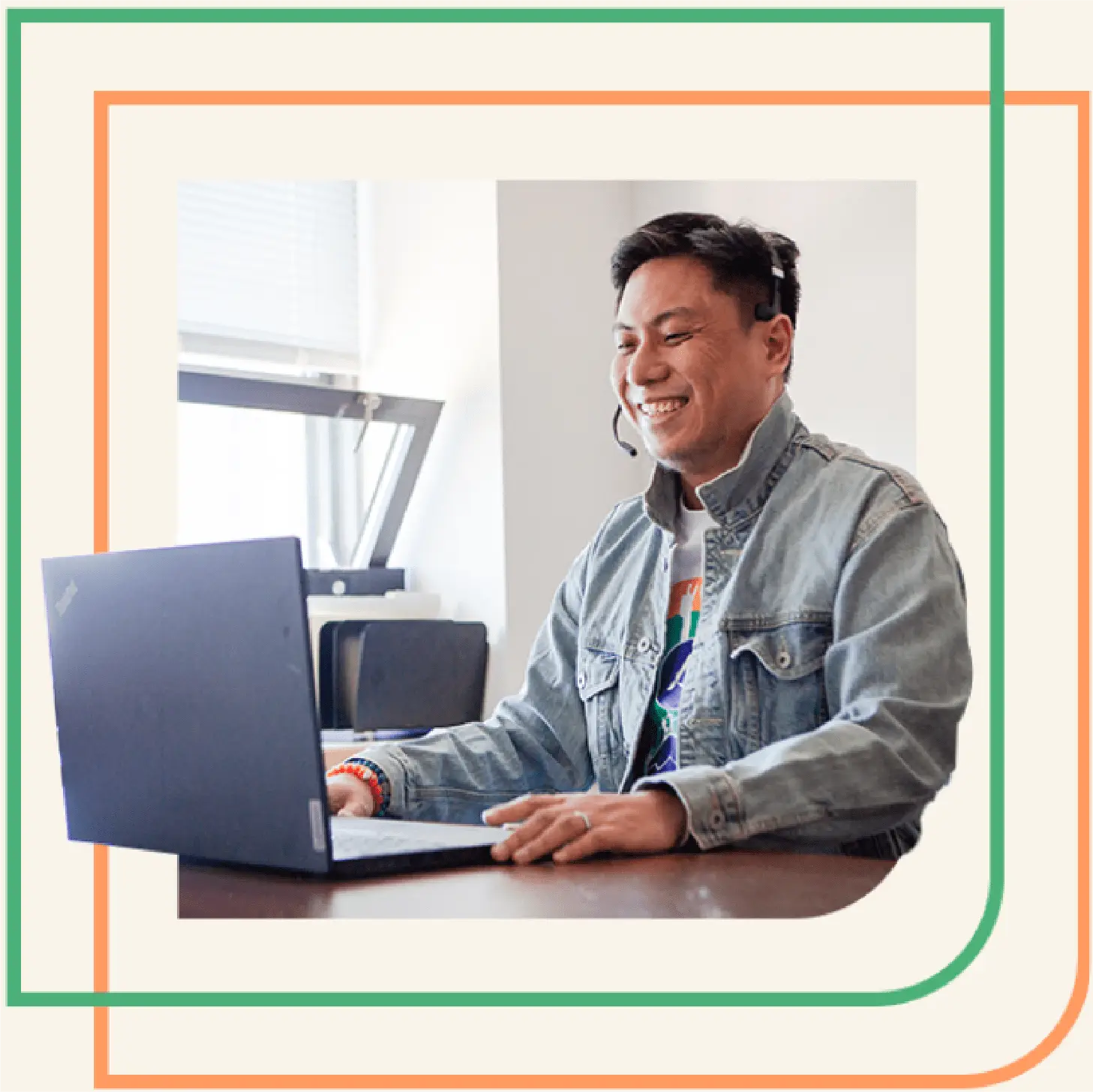 A Peak Support agent wearing a headset smiles while working on a laptop—ready to assist across multiple channels and deliver seamless, personalized support. Peak Support combines technology and empathy to elevate customer experience.