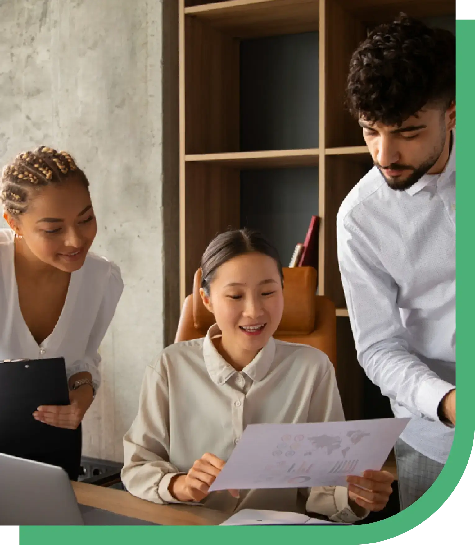 Three professionals collaborate in an office, reviewing financial documents on paper and laptop. The image highlights Peak Support’s modern outsourcing approach for financial services, positioning it as a strategic investment to drive business growth, scalability, and long-term results.