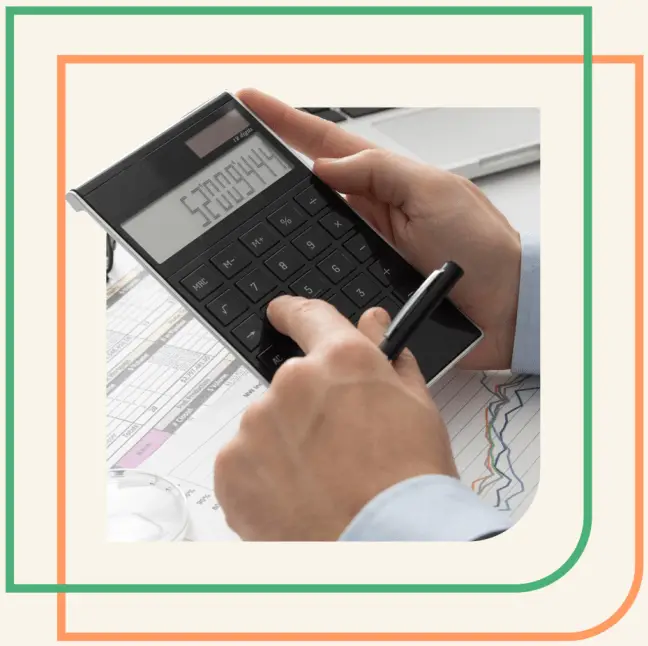 A professional uses a calculator while reviewing financial reports, representing Peak Support’s expertise in managing back office accounting services like invoicing, reporting, and accounts receivable with accuracy and efficiency. Peak Support provides trusted, data-driven outsourcing services.
